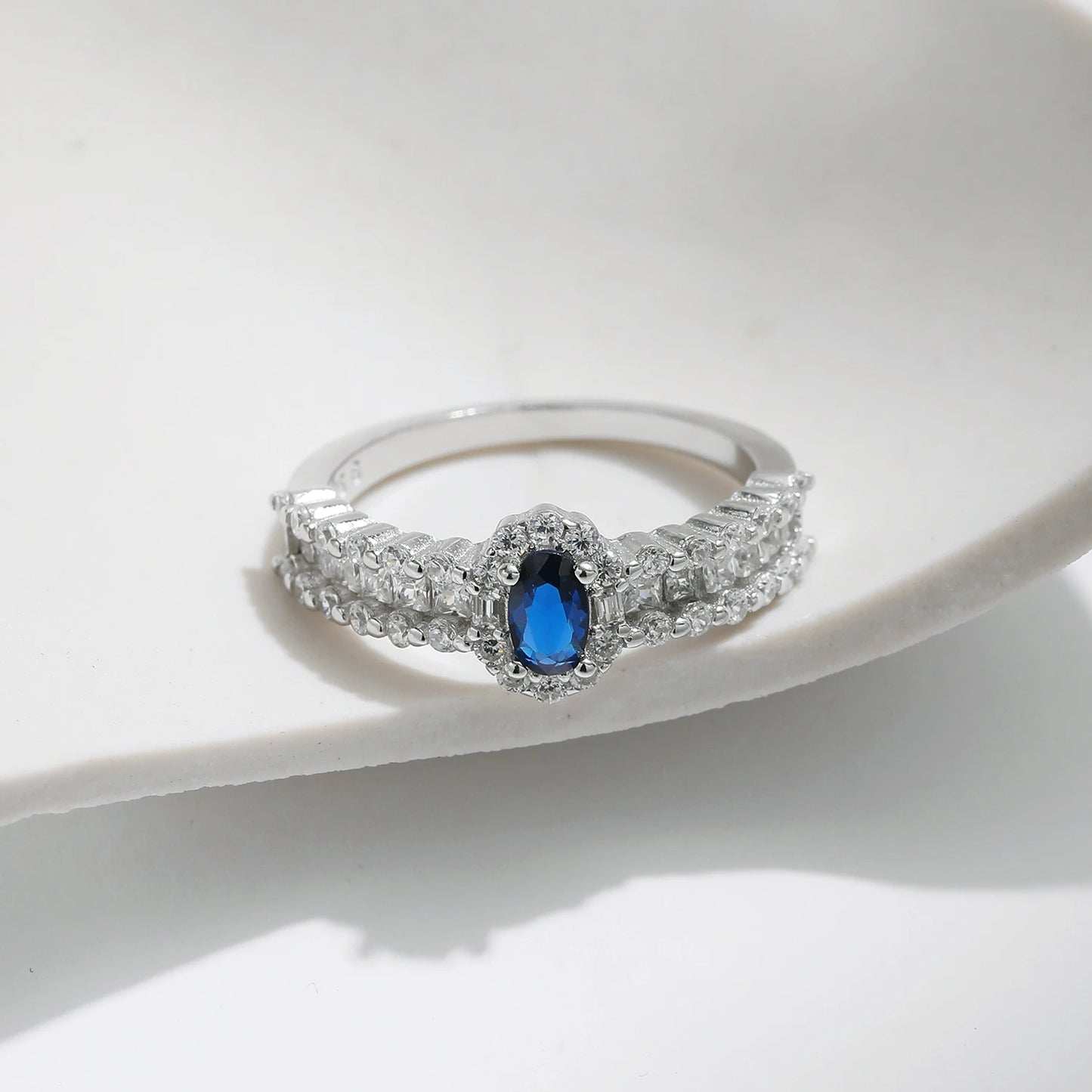 Sapphire Sparkle: Oval Blue CZ Wedding Band in 925 Sterling Silver