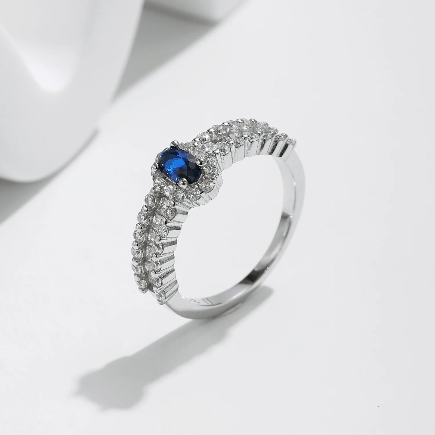 Sapphire Sparkle: Oval Blue CZ Wedding Band in 925 Sterling Silver