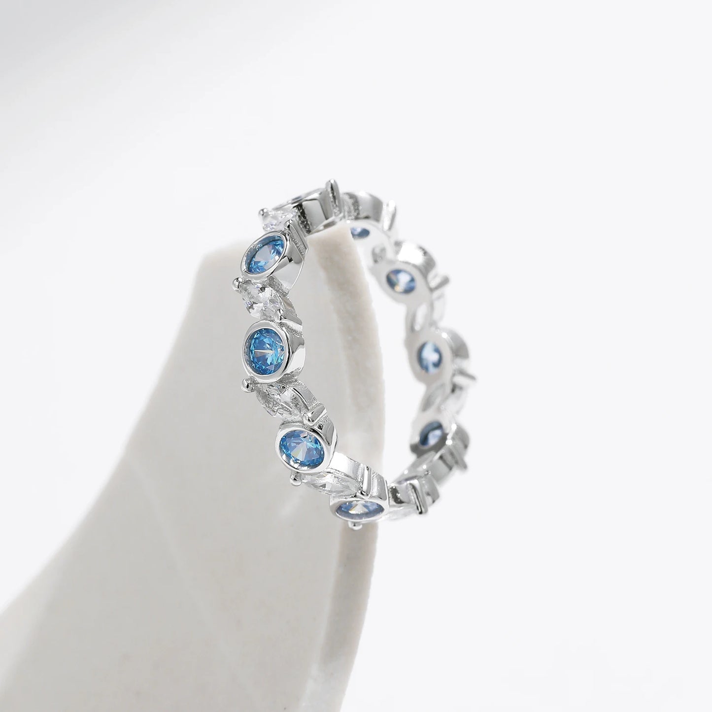 Azure Majesty: Ocean Blue CZ Eternity Ring in 925 Sterling Silver