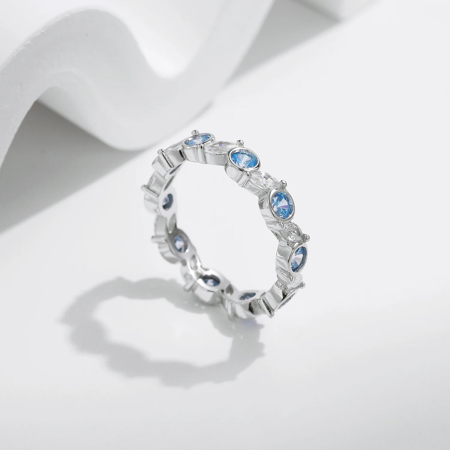 Azure Majesty: Ocean Blue CZ Eternity Ring in 925 Sterling Silver